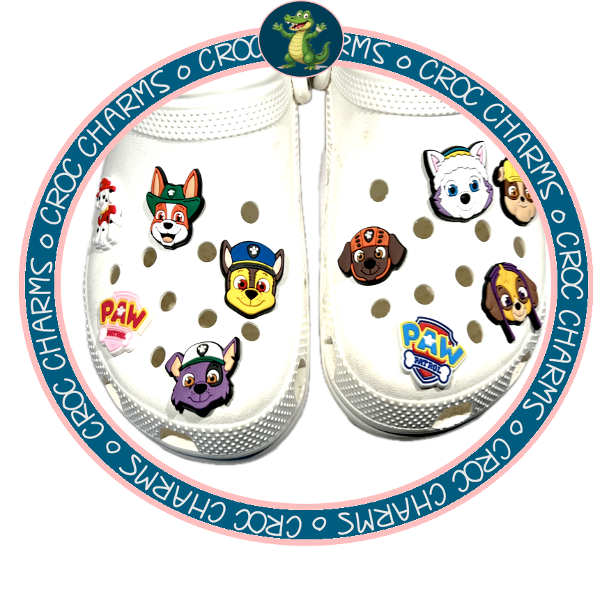 White Crocs decorated with various colorful Paw Patrol shoe charms featuring popular characters